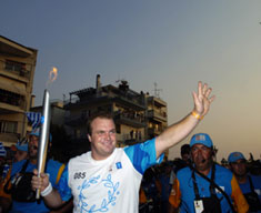 22 July: Torchbearer and European Champion in Shot Put, Alexandros Papadimitriou, carries the Olympic flame in Poligyros.  ANA/ ATHOC/ D. Krezias